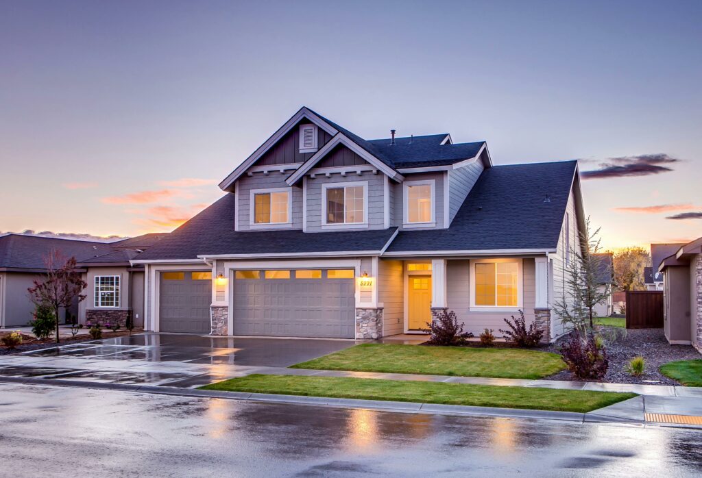 pexels-photo-186077-186077 Elegant suburban home with driveway at sunset showcasing modern architecture.